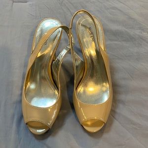 Taupe sling back high heels. Worn only a few times. Good condition.